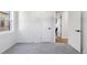 Cozy bedroom with plush carpeting, showcasing interior door and adjacent room with hardwood flooring at 2430 Eaton St, Edgewater, CO 80214