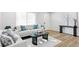 Bright living room featuring light colored walls, hardwood floors, and modern furniture at 2430 Eaton St, Edgewater, CO 80214