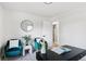 Bright home office featuring stylish desk, velvet chairs, and natural light at 2430 Eaton St, Edgewater, CO 80214