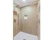 Stylish tiled shower has double shower heads and a built-in niche for storage at 2430 Eaton St, Edgewater, CO 80214