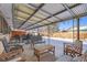 Covered patio with seating area, great for outdoor entertaining, overlooks the backyard at 4481 W 89Th Way, Westminster, CO 80031