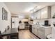 Well-equipped basement kitchen features modern cabinetry, white subway tile, and stainless steel appliances at 4481 W 89Th Way, Westminster, CO 80031