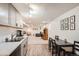 Open concept basement kitchen and living area with modern finishes and a dining area at 4481 W 89Th Way, Westminster, CO 80031