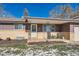 Covered porch with rocking chairs, perfect for relaxing outdoors at 4481 W 89Th Way, Westminster, CO 80031