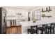 Modern kitchen with white cabinets, stainless steel appliances, and a breakfast bar at 4481 W 89Th Way, Westminster, CO 80031