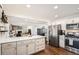 Updated kitchen featuring white cabinets, quartz countertops, and stainless steel appliances at 4481 W 89Th Way, Westminster, CO 80031