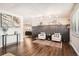 Living room featuring hardwood floors, two armchairs, and a fireplace at 4481 W 89Th Way, Westminster, CO 80031