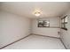 Clean bedroom with neutral carpet, base trim and windows at 837 Meadow Run, Golden, CO 80403