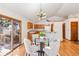 Cozy dining area with hardwood floors, sliding glass doors to the deck, and stylish lighting at 837 Meadow Run, Golden, CO 80403