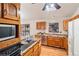 Functional kitchen with ample cabinetry, stainless steel appliances, and granite countertops at 837 Meadow Run, Golden, CO 80403