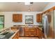 Kitchen featuring stainless steel appliances, granite countertops and light wood cabinets at 837 Meadow Run, Golden, CO 80403