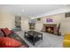 Finished basement with stone fireplace and comfortable seating area at 1795 N Monaco St Pkwy, Denver, CO 80224
