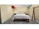 Basement bedroom with neutral walls and patterned bedspread at 1795 N Monaco St Pkwy, Denver, CO 80224