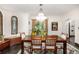 Bright dining room features a large window, hardwood floors, and a decorative chandelier at 1795 N Monaco St Pkwy, Denver, CO 80224