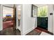 Hallway view to include half door, access to living room, and access to bathroom at 1795 N Monaco St Pkwy, Denver, CO 80224