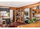 Bright living room features a bar, bookshelves, and a plush sofa at 1795 N Monaco St Pkwy, Denver, CO 80224