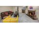 Finished basement living room with a stone fireplace and comfortable seating at 1795 N Monaco St Pkwy, Denver, CO 80224