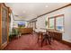 Bright living room features a large window, hardwood floors, and a plush sofa at 1795 N Monaco St Pkwy, Denver, CO 80224