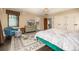Bright main bedroom featuring unique decor, and large windows with a bathroom en suite at 1795 N Monaco St Pkwy, Denver, CO 80224