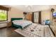 Bright main bedroom featuring unique decor, large windows, and warm natural light at 1795 N Monaco St Pkwy, Denver, CO 80224