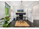 Bright office space featuring custom windows, hardwood floors, and built-in shelving at 1795 N Monaco St Pkwy, Denver, CO 80224