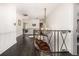 Hallway staircase with decorative wrought iron railing at 1795 N Monaco St Pkwy, Denver, CO 80224