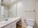 Bright bathroom featuring a large mirror, vanity sink, and tiled shower/tub combo at 13598 E Asbury Dr, Aurora, CO 80014