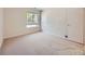 Neutral bedroom with ample natural light and plush carpeting at 13598 E Asbury Dr, Aurora, CO 80014