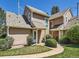 Exterior of townhomes with neutral siding, well-kept lawns, and inviting entrances at 13598 E Asbury Dr, Aurora, CO 80014