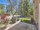 A front yard with small bushes, a grassy area, and a concrete walkway at 13598 E Asbury Dr, Aurora, CO 80014