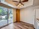 Bright eat-in kitchen area with sliding glass doors and wood-look floors at 13598 E Asbury Dr, Aurora, CO 80014