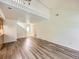 Open-concept living area with wood-look floors and ample natural light at 13598 E Asbury Dr, Aurora, CO 80014