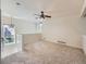 Cozy loft area with a ceiling fan, natural light, and plush carpeting at 13598 E Asbury Dr, Aurora, CO 80014