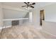 Bright loft space with a ceiling fan, railing, and doorways to other rooms at 13598 E Asbury Dr, Aurora, CO 80014