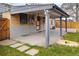 A covered back patio made of brick and concrete extends the home's footprint at 424 S Leyden St, Denver, CO 80224