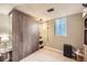 Finished basement has a large closet with stylish doors and a modern light fixture at 424 S Leyden St, Denver, CO 80224