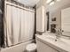 Clean bathroom with white vanity and updated shower/tub at 424 S Leyden St, Denver, CO 80224