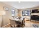 Bright dining room with hardwood floors, large windows, and a modern table setting for entertaining at 424 S Leyden St, Denver, CO 80224