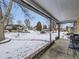 Covered porch overlooking a snow-covered neighborhood at 424 S Leyden St, Denver, CO 80224