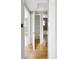 Hallway shows access to bathroom, closet and a view of the adjacent living area at 424 S Leyden St, Denver, CO 80224