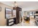 Bright kitchen with stainless steel appliances, dark cabinets, and seamless flow into the dining area at 424 S Leyden St, Denver, CO 80224