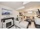 Finished basement lounge area with stone fireplace and large sectional sofa at 424 S Leyden St, Denver, CO 80224
