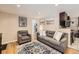 Cozy living room featuring neutral tones, a comfortable sofa, and stylish decor for a welcoming atmosphere at 424 S Leyden St, Denver, CO 80224
