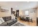 Comfortable living space featuring a cozy sofa, open layout, and connection to the dining area at 424 S Leyden St, Denver, CO 80224