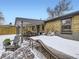 Covered patio and backyard with snow at 424 S Leyden St, Denver, CO 80224