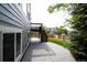 Home's backyard features stamped concrete patio and access to wood deck at 5550 Fox Meadow Ave, Highlands Ranch, CO 80130