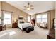 Comfortable bedroom featuring vaulted ceilings, neutral tones, and abundant natural light at 5550 Fox Meadow Ave, Highlands Ranch, CO 80130