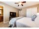 Comfortable bedroom with ceiling fan, closet, and television on table at 5550 Fox Meadow Ave, Highlands Ranch, CO 80130