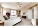Bedroom with vaulted ceiling featuring neutral walls, soft carpet, and bright, natural light at 5550 Fox Meadow Ave, Highlands Ranch, CO 80130
