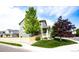 Corner lot home with a wood fence, mature trees, and a cozy covered porch at 5550 Fox Meadow Ave, Highlands Ranch, CO 80130